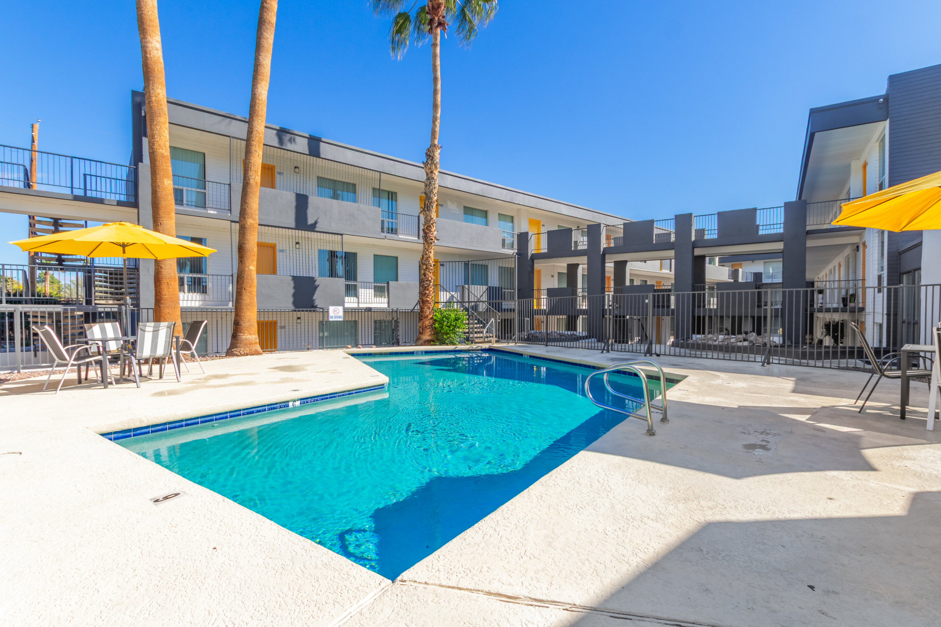 Pool and poolside area at Radius Apartments.
