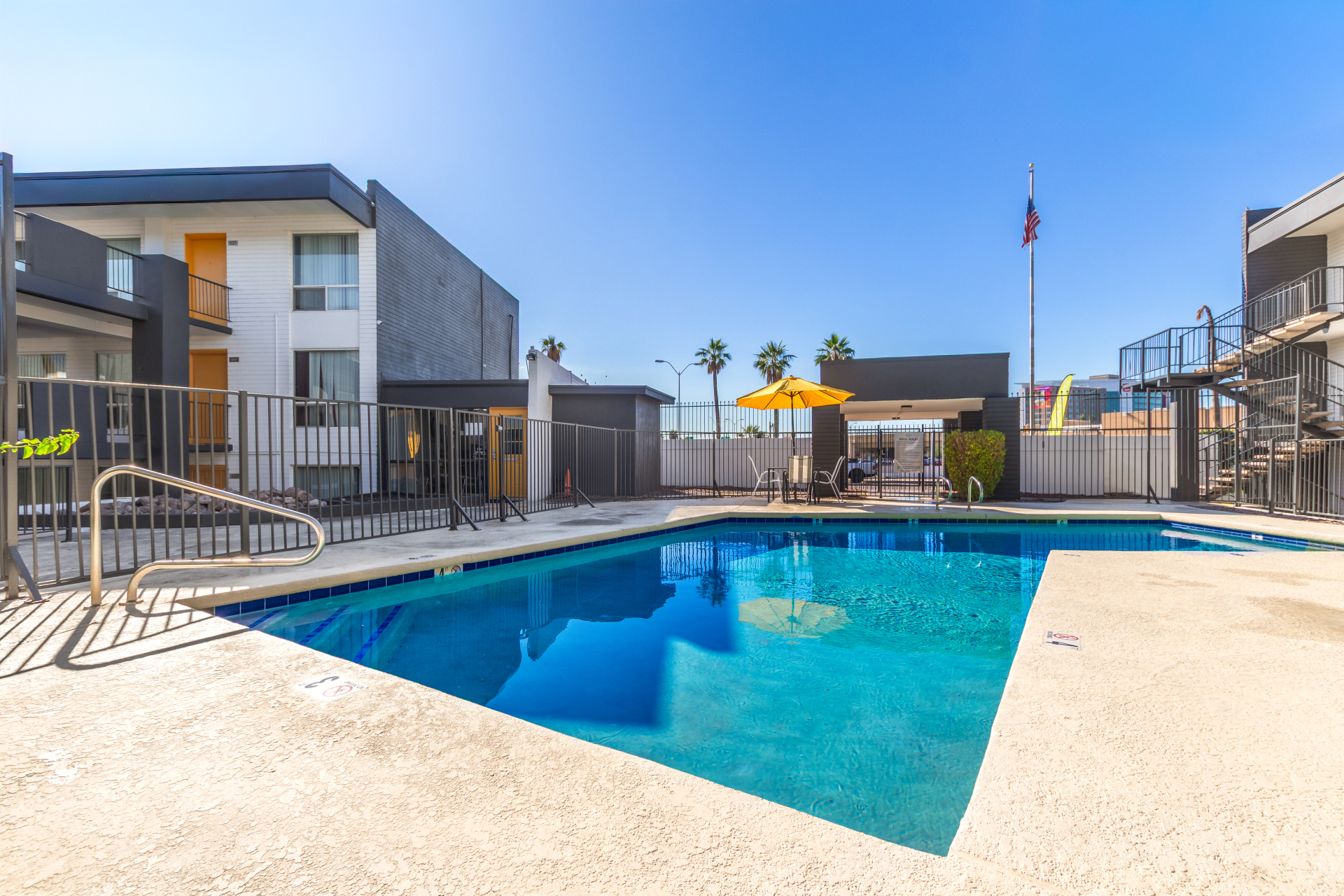 Pool and poolside area at Radius Apartments.